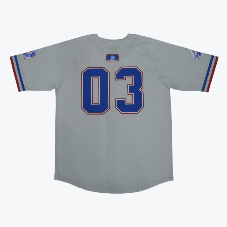 The back of a light grey baseball jersey displaying the number 03 in blue with a red outline, set against a plain white background.