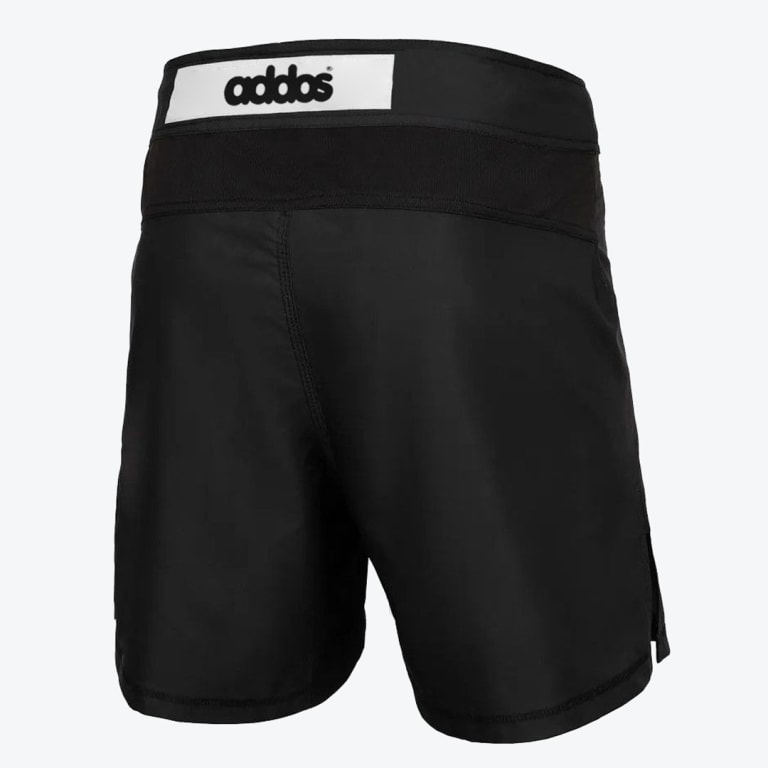 Back view of black athletic combat shorts featuring a white addos logo patch on the waistband against a white background.