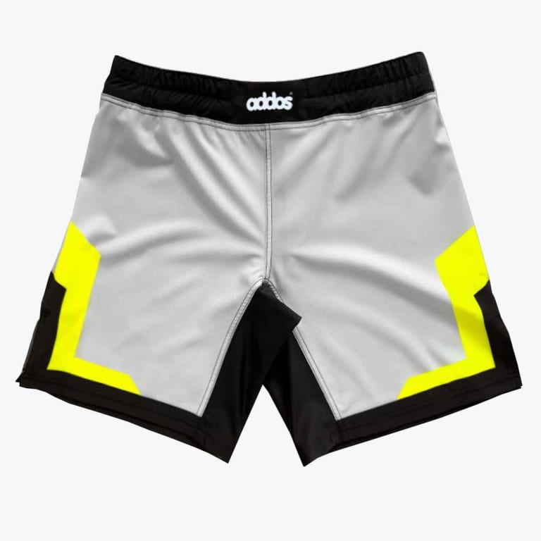 A pair of light gray athletic shorts with a black waistband, black bottom trim, and bright neon yellow geometric designs on the sides, set against a plain white background.
