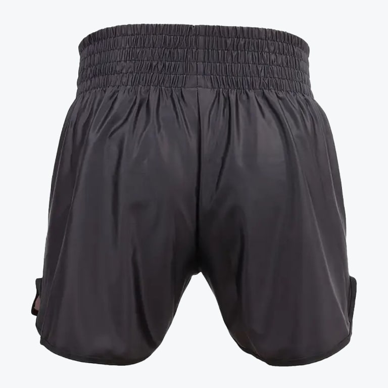 The back view of a pair of black satin Muay Thai shorts featuring a thick gathered elastic waistband, isolated on a plain white background.