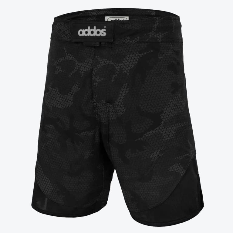A front view of black and dark grey camouflage athletic shorts with a hook-and-loop waistband featuring the addos logo.