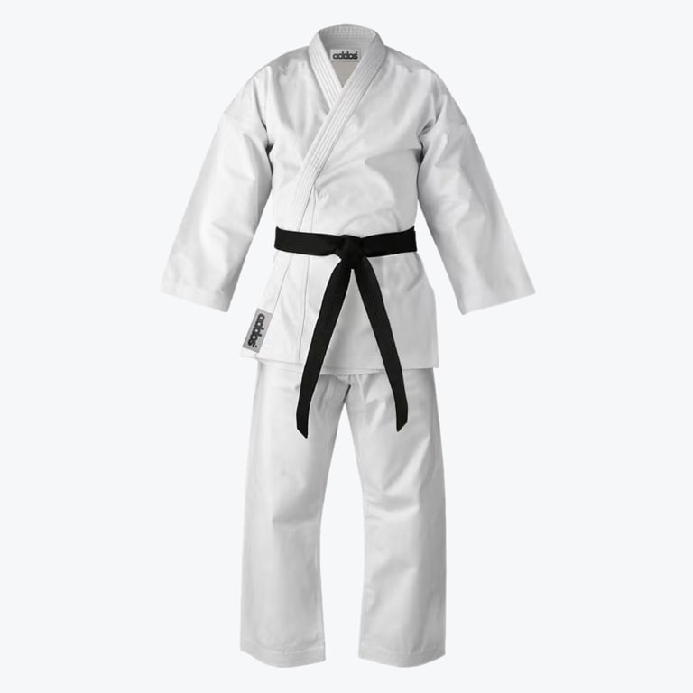 A full-length view of a white Addos karate gi uniform featuring a black belt tied at the waist, displayed against a solid white background.