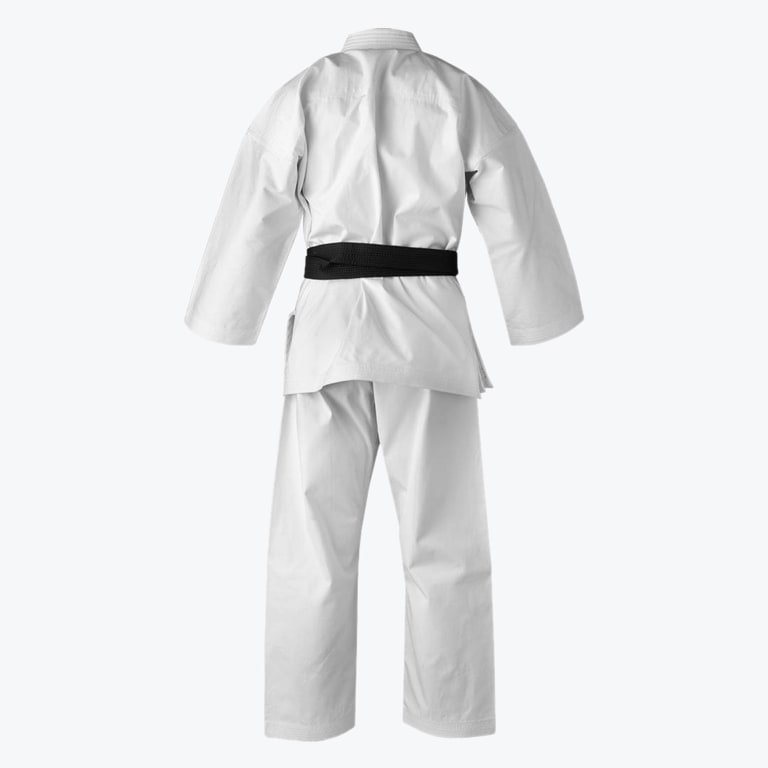 Rear view of a white martial arts gi with a black belt tied around the waist, isolated on a white background.