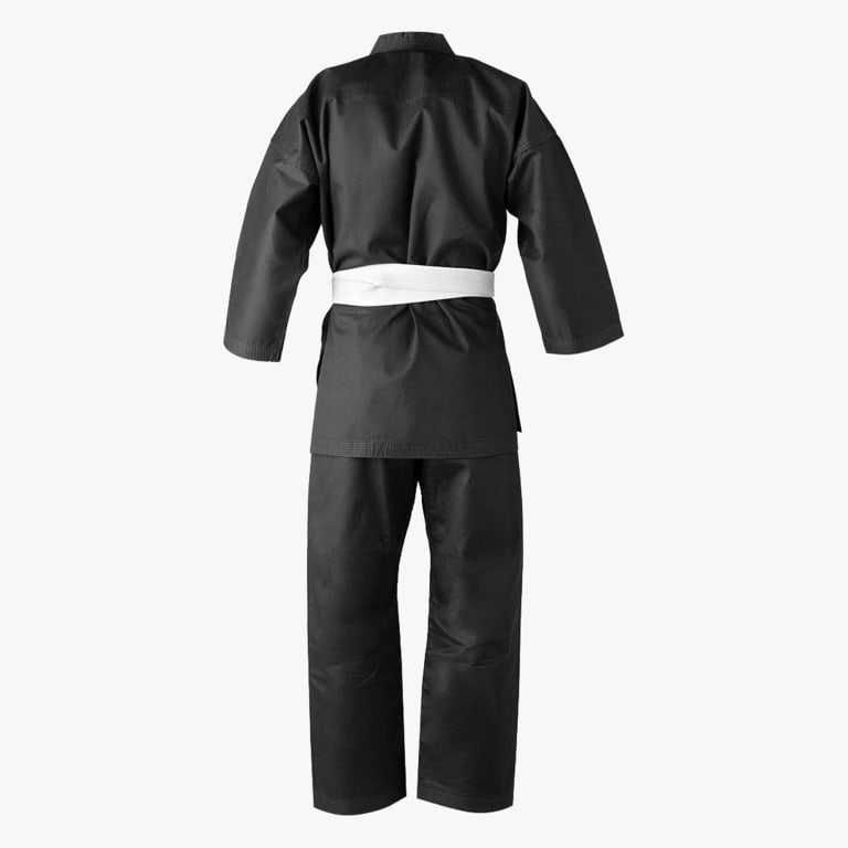 The back view of a black martial arts uniform consisting of a jacket and pants, tied with a white belt, isolated on a white background.