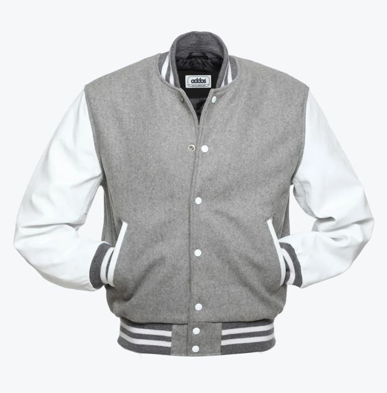 A grey and white varsity jacket with snap buttons and striped ribbed trim against a white background.
