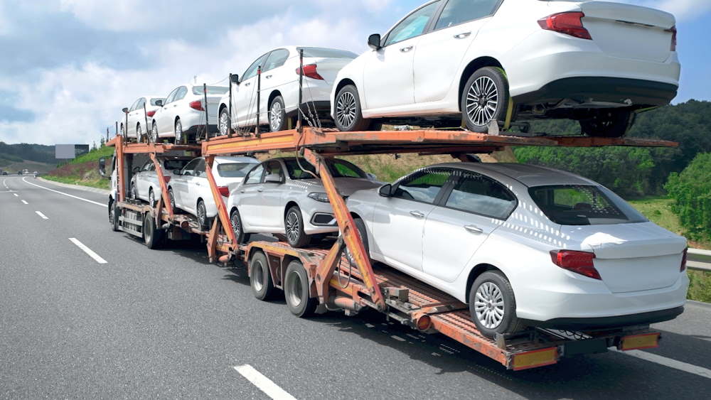 Delivering cars for sale by truck