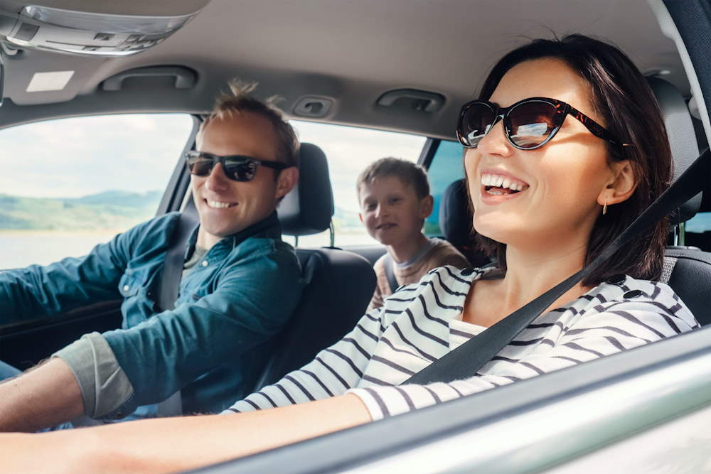 happy family in a leased car