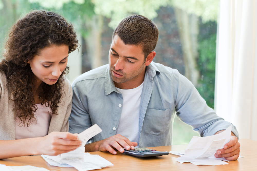 Family calculating their costs