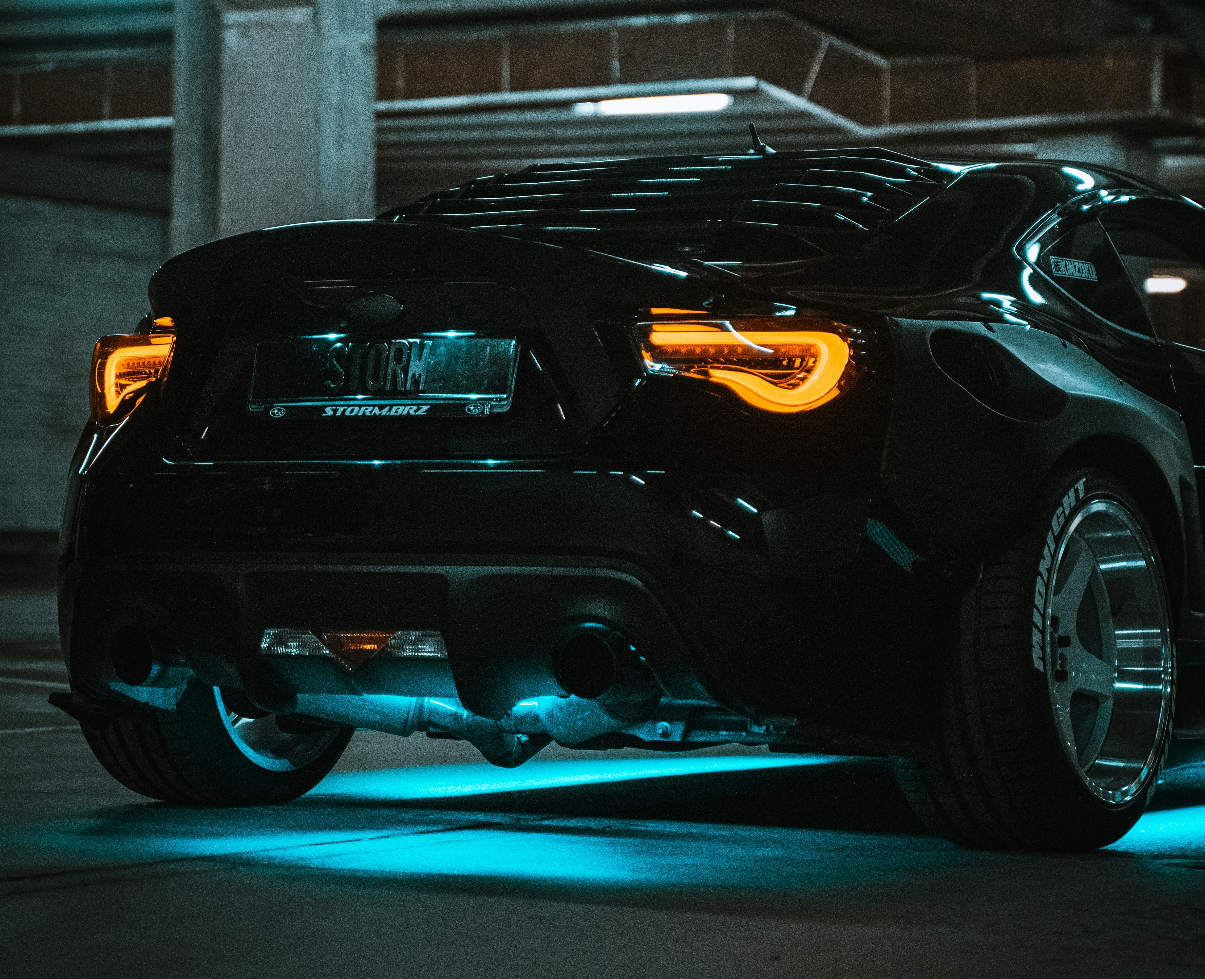 blue underglow on a black sedan