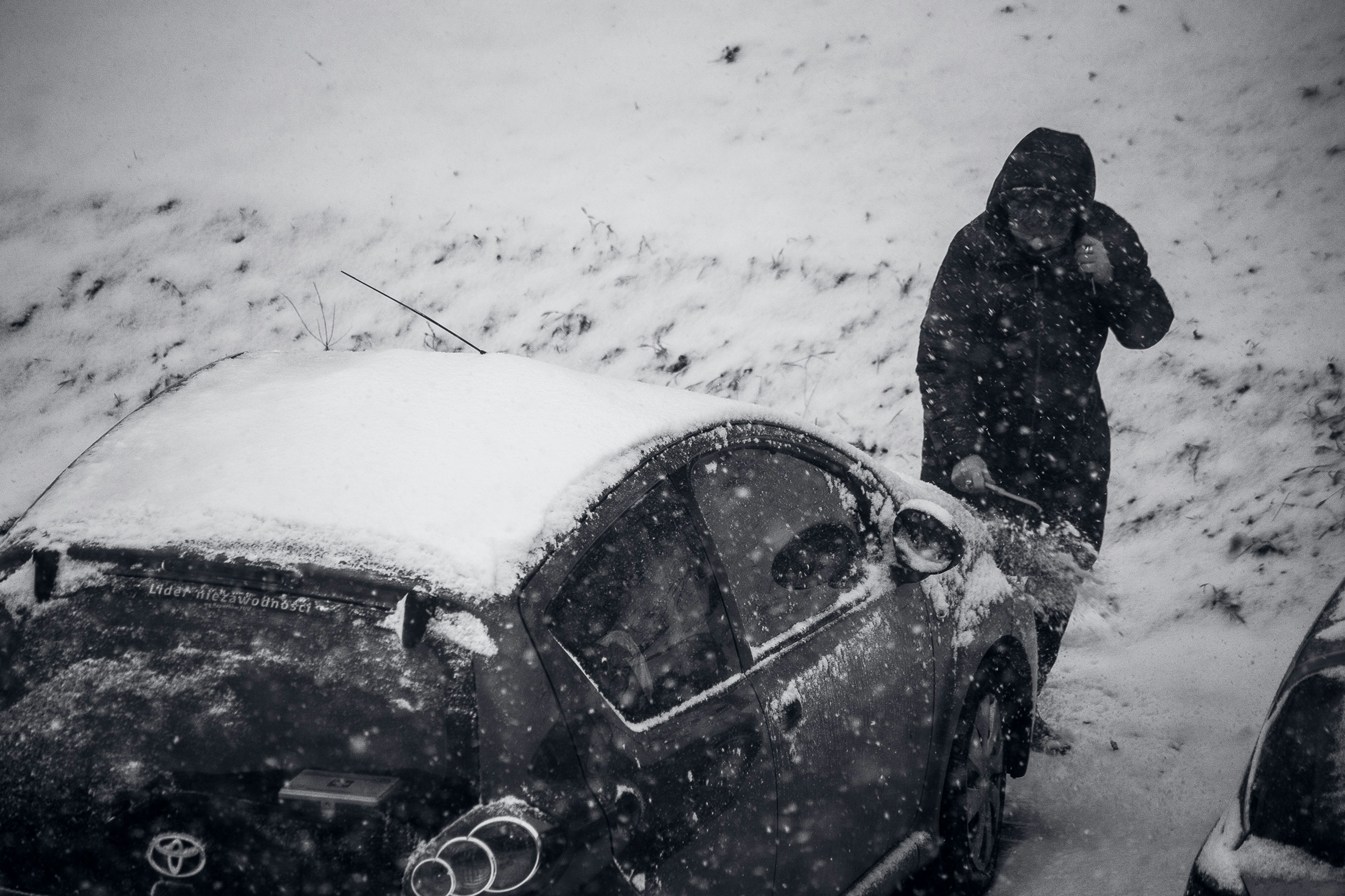 person and car in snow