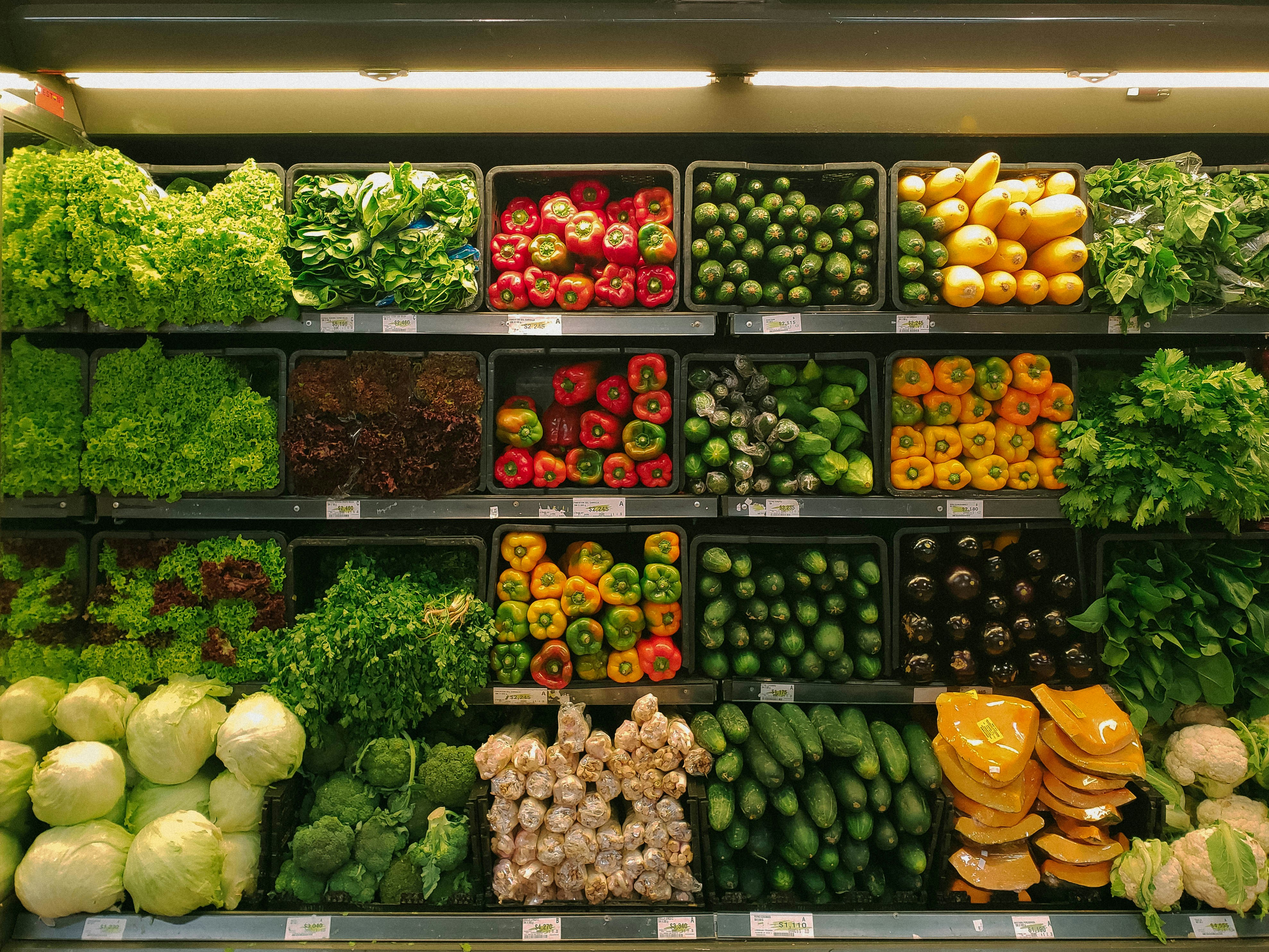 neatly stacked grocery store produce section