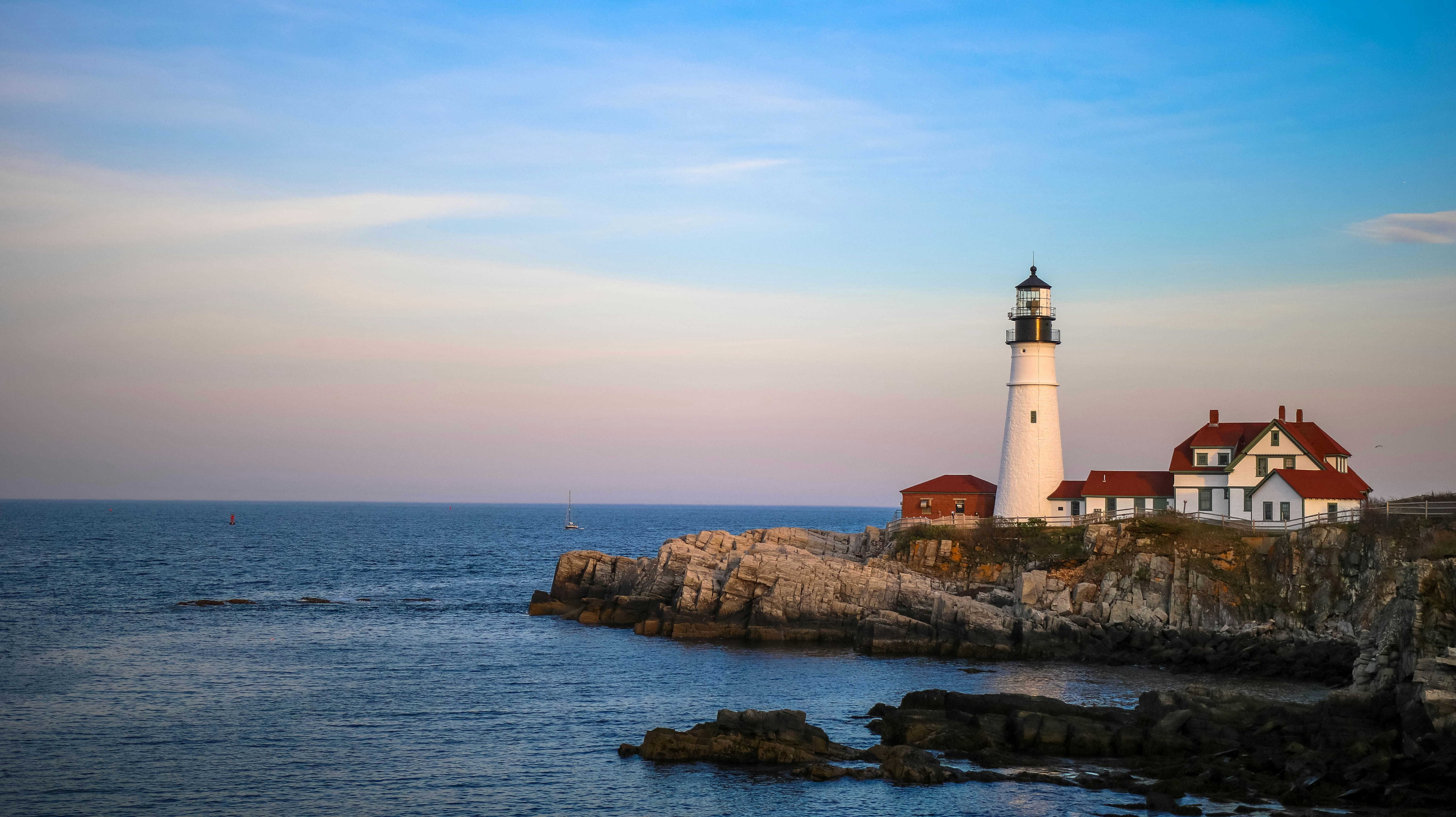 lighthouse on rocks on the ocean