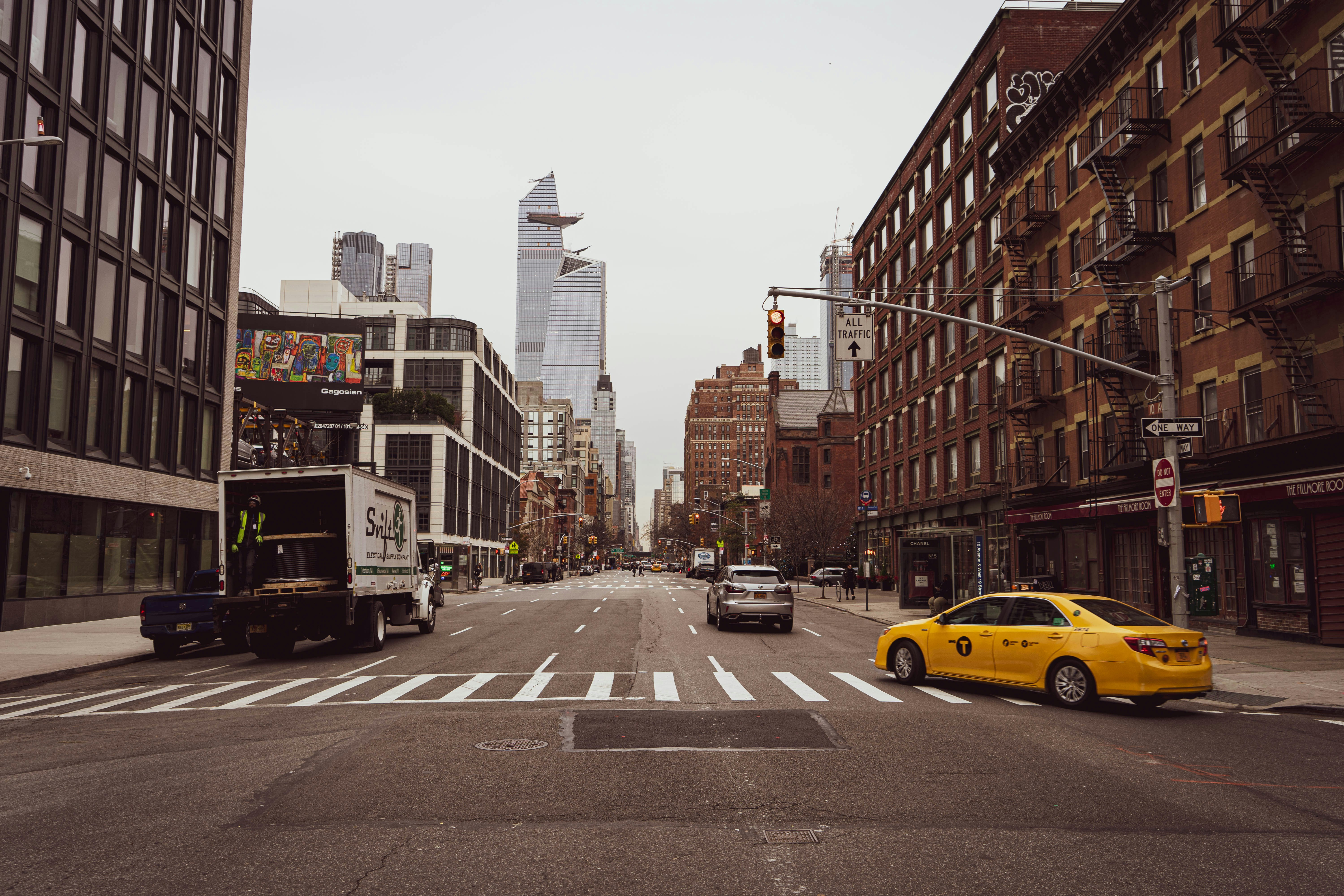 yellow cab turning corner in NYC