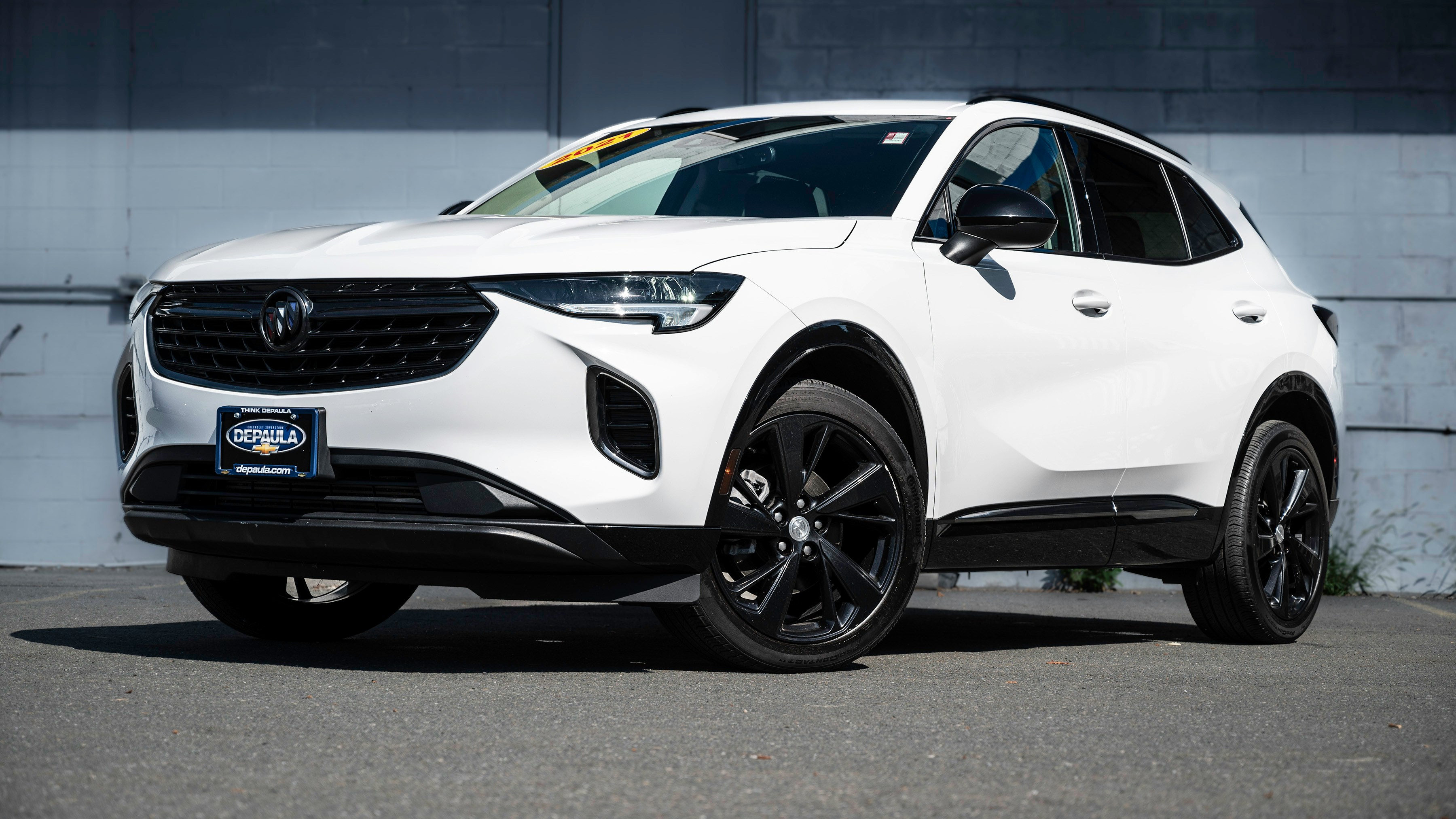white crossover in parking lot