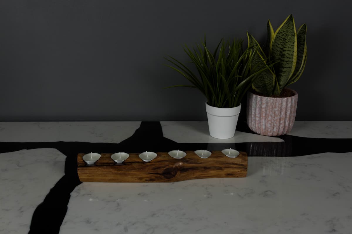The Ollerton Tealight Board, a solid oak board holding six tealights