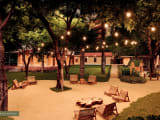 Thumbnail: Praça Arraial, lit outdoor gathering area