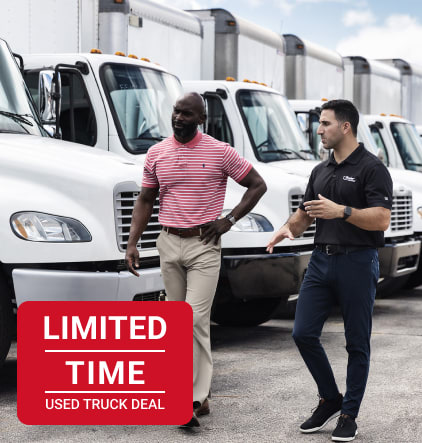 image with white trucks lined up and limited time used truck deal text banner