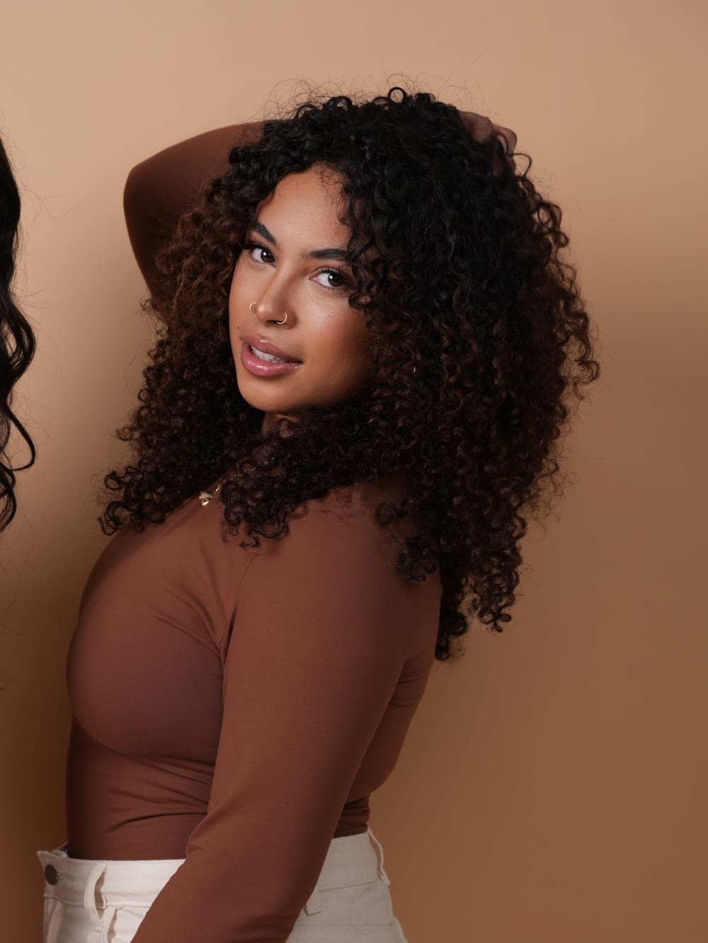 A SMOOTHED client with defined curly hair