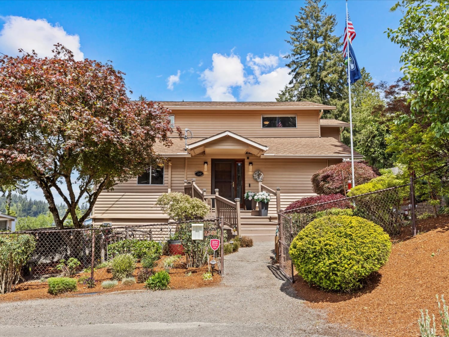 Landscaped front approach and main entry