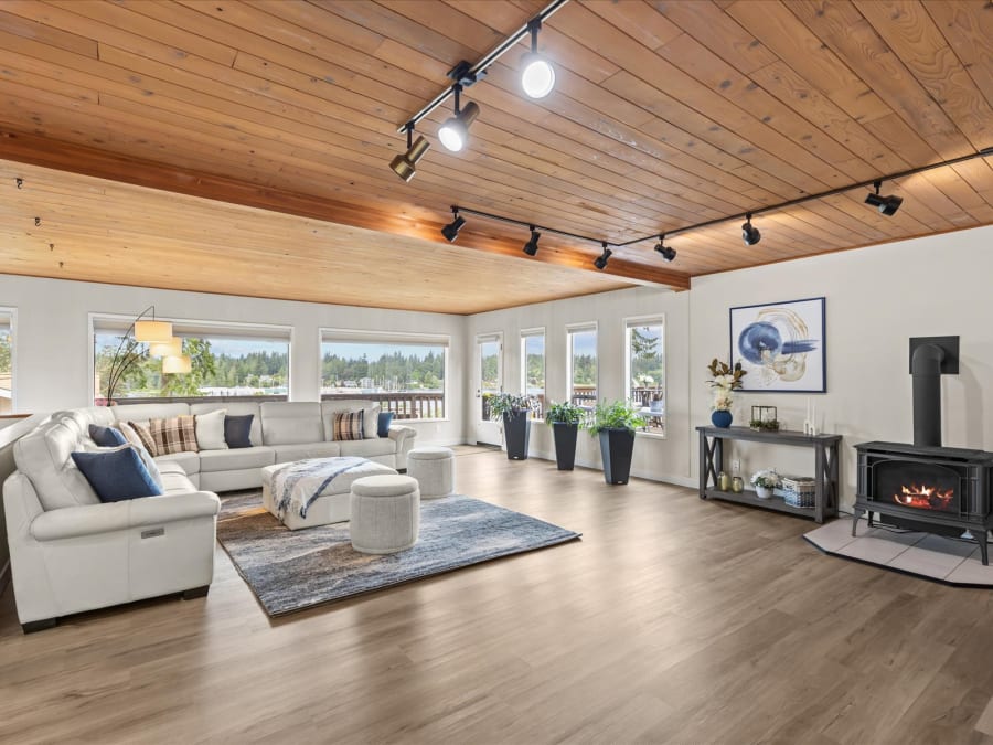 Living room with cedar ceiling, LVP flooring and bay windows