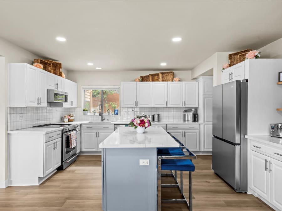 Updated kitchen cabinetry and backsplash