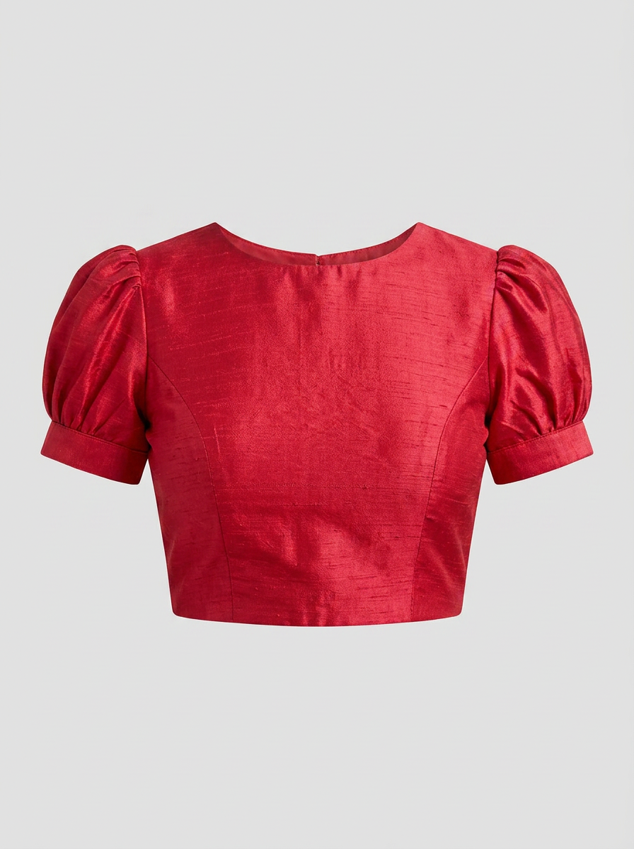 Front view of a vibrant red art silk blouse with puffed short sleeves and a round neck, displayed on a light background.