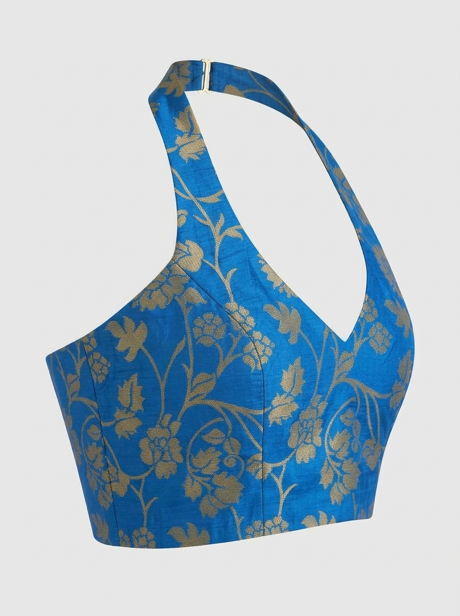 Side perspective of royal blue halter neck saree blouse demonstrating fitted armhole and sleek silhouette.
