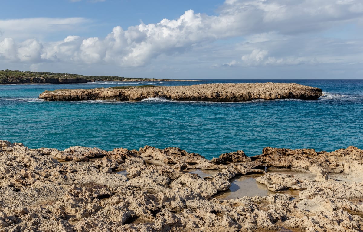 A rocky island in a blue lagoon off the Akamas coast, Cyprus