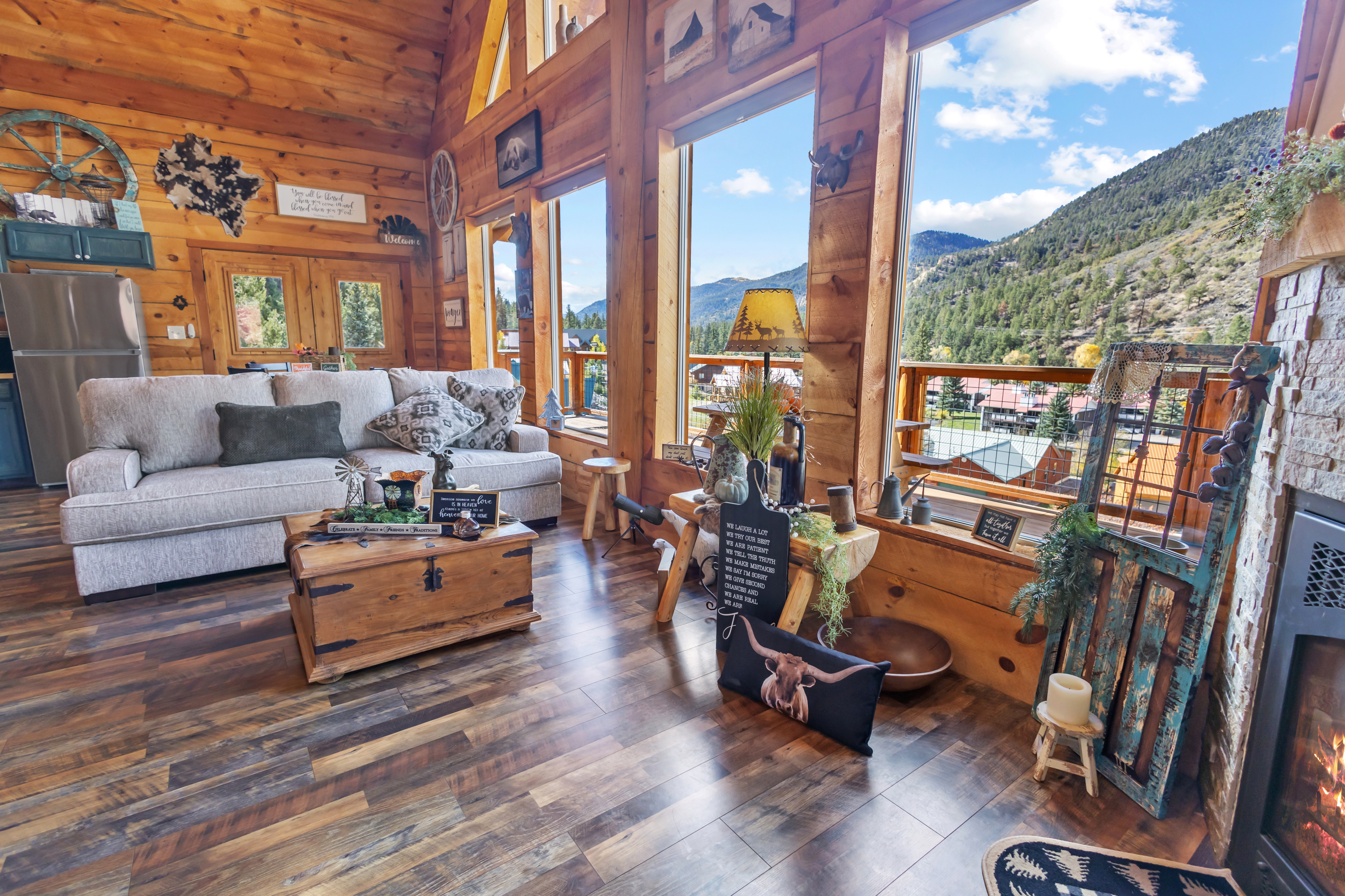 Living room at 1212 LaBelle Ct with floor-to-ceiling windows and mountain views