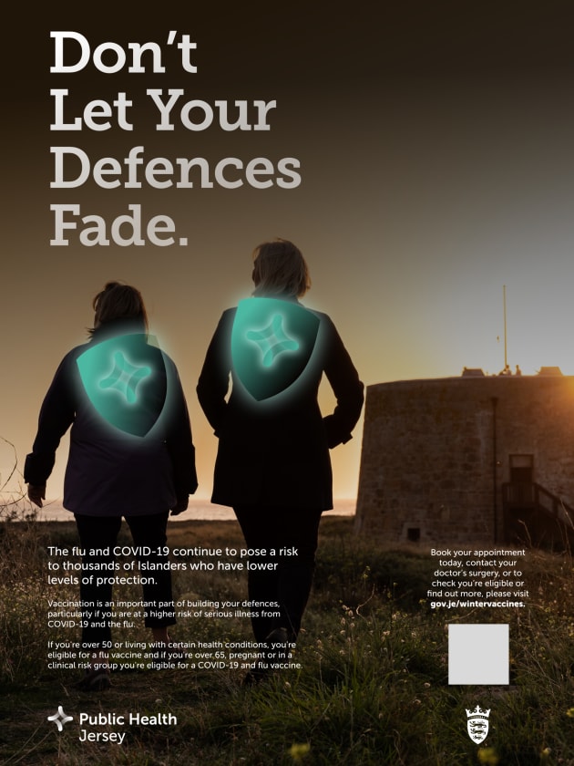 Portrait shape vaccine advert with two people walking along the coast