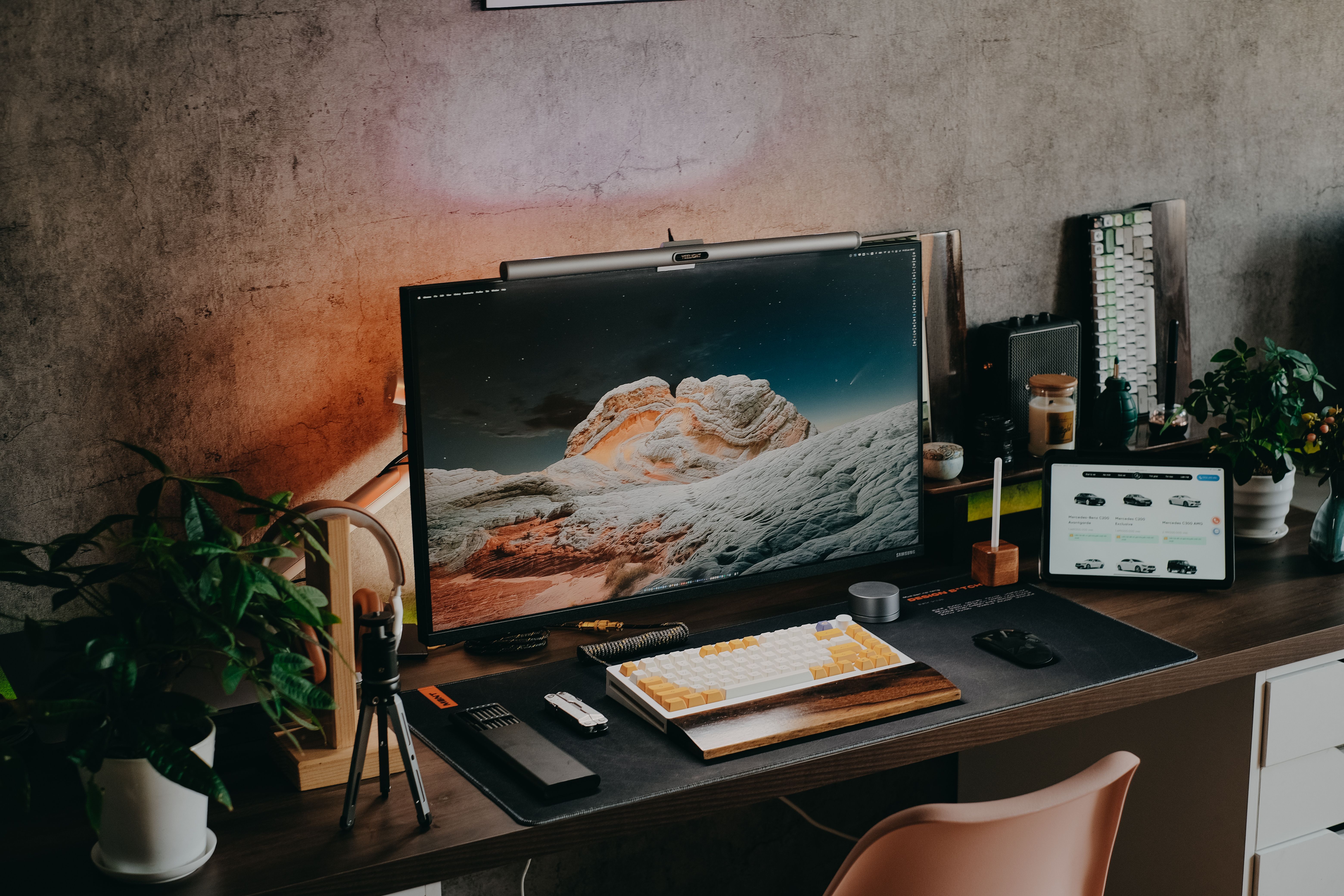A quiet workspace at night lit only by screen glow