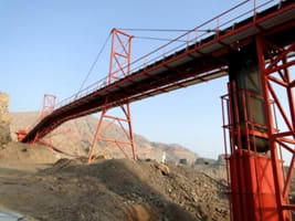 high capacity downhill conveyor belt with power generator to produce electricity