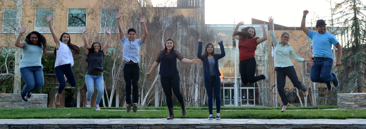 Quetzalmama students jumping in the air with excitement