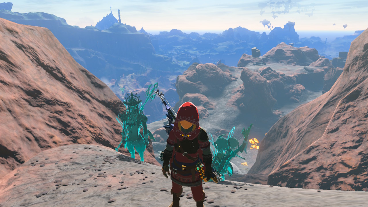 Link standing at the base of Death Mountain, flanked by the avatars of Tullin and Sidon, with the landscape stretching out behind them