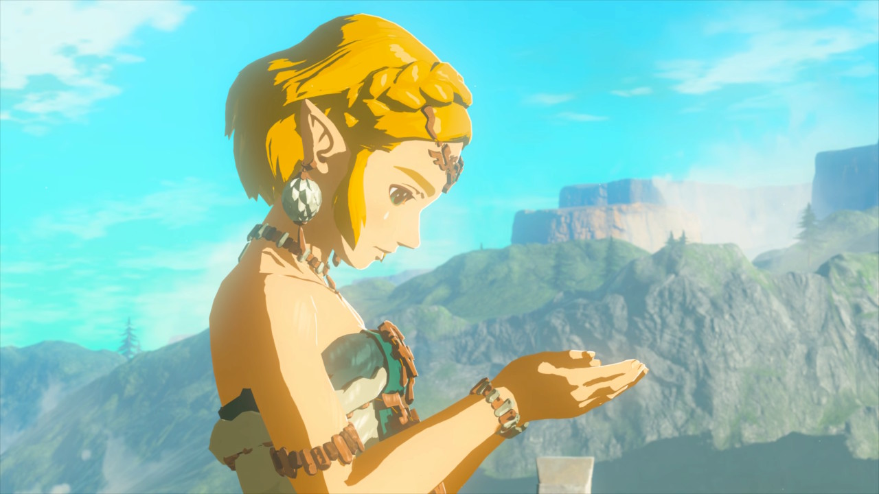 Zelda in profile, looking down at her cupped hands