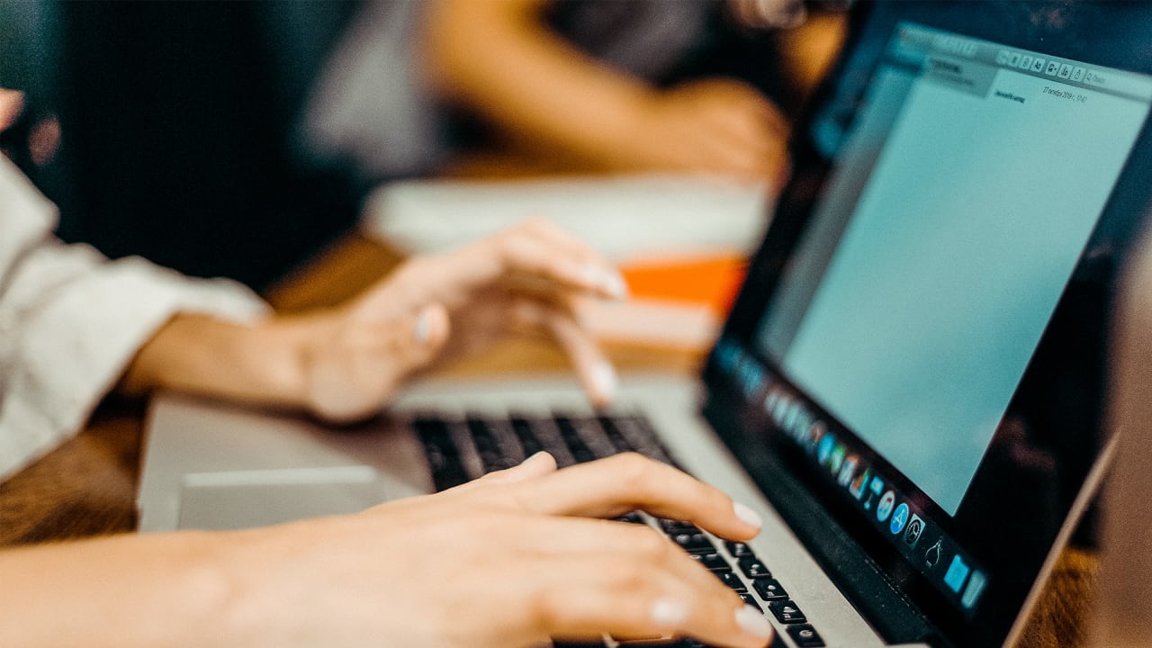 Business accessing Gipro Pro Profile feature on laptop.