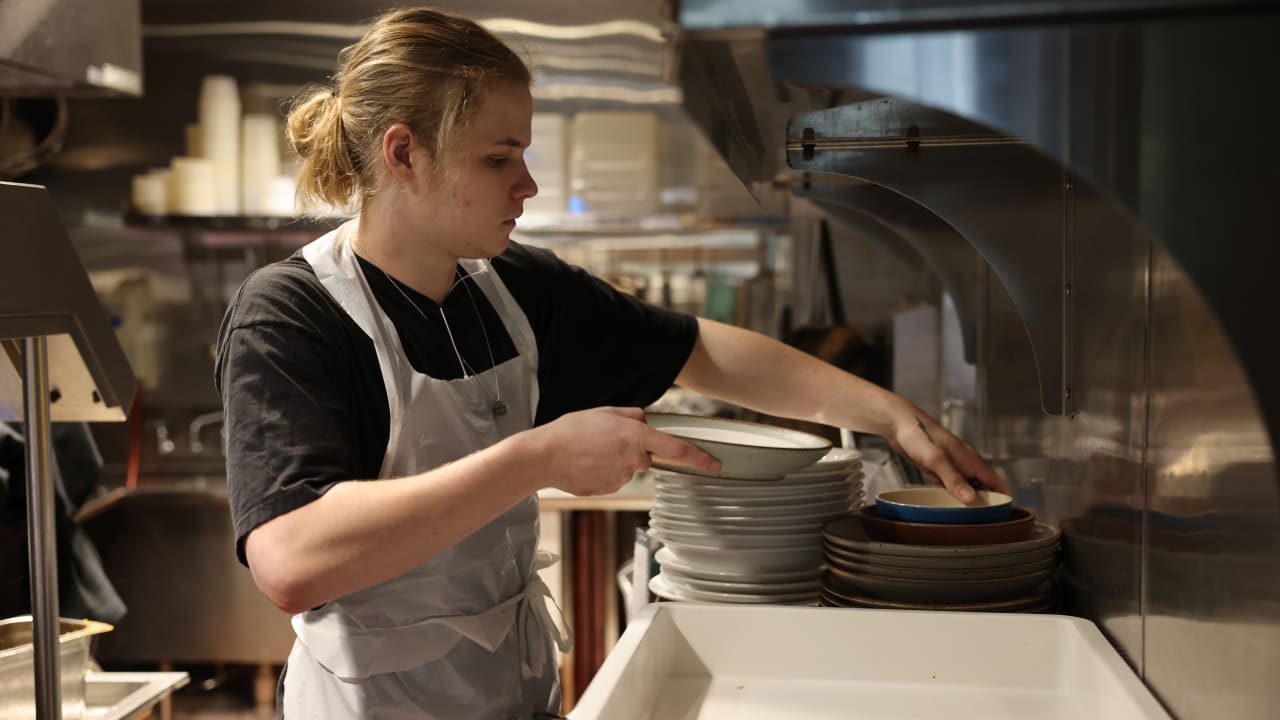 Gigpro dishwasher putting dishes away at Obstinate Daughter Sullivan's Island, SC.