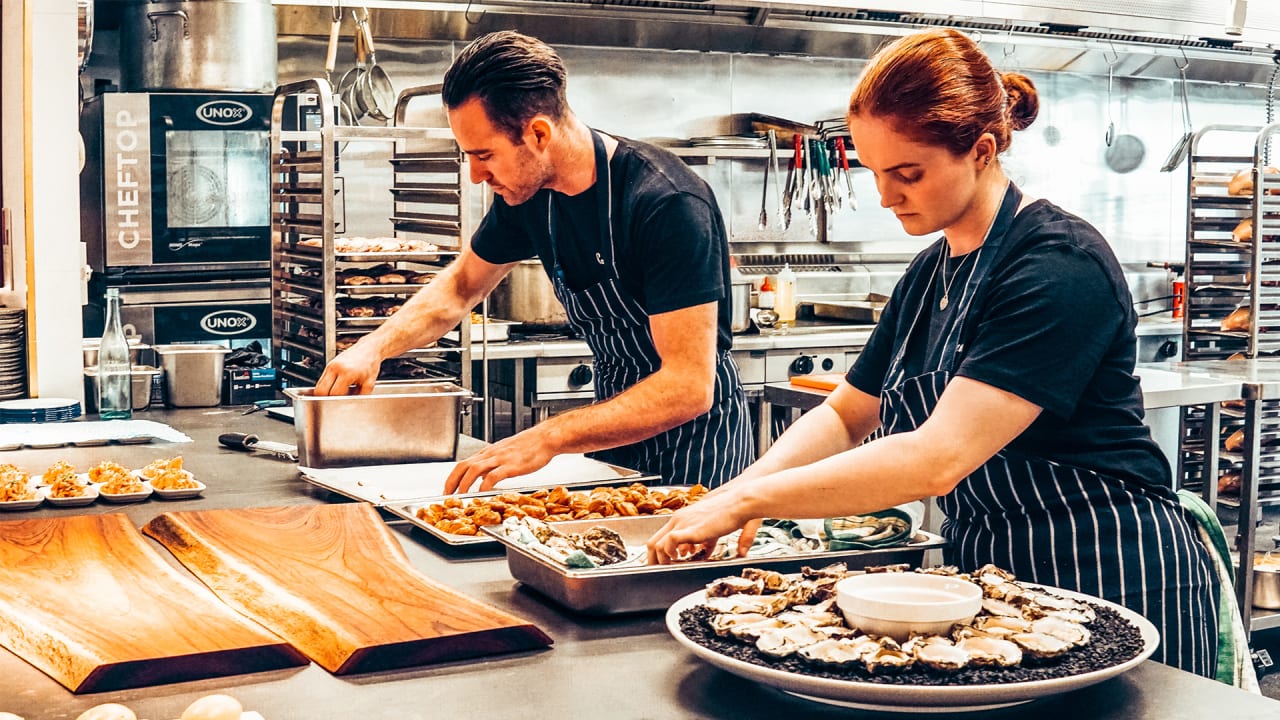 Gigpro prep cook and line cook plating food for restaurant service or banquet. 