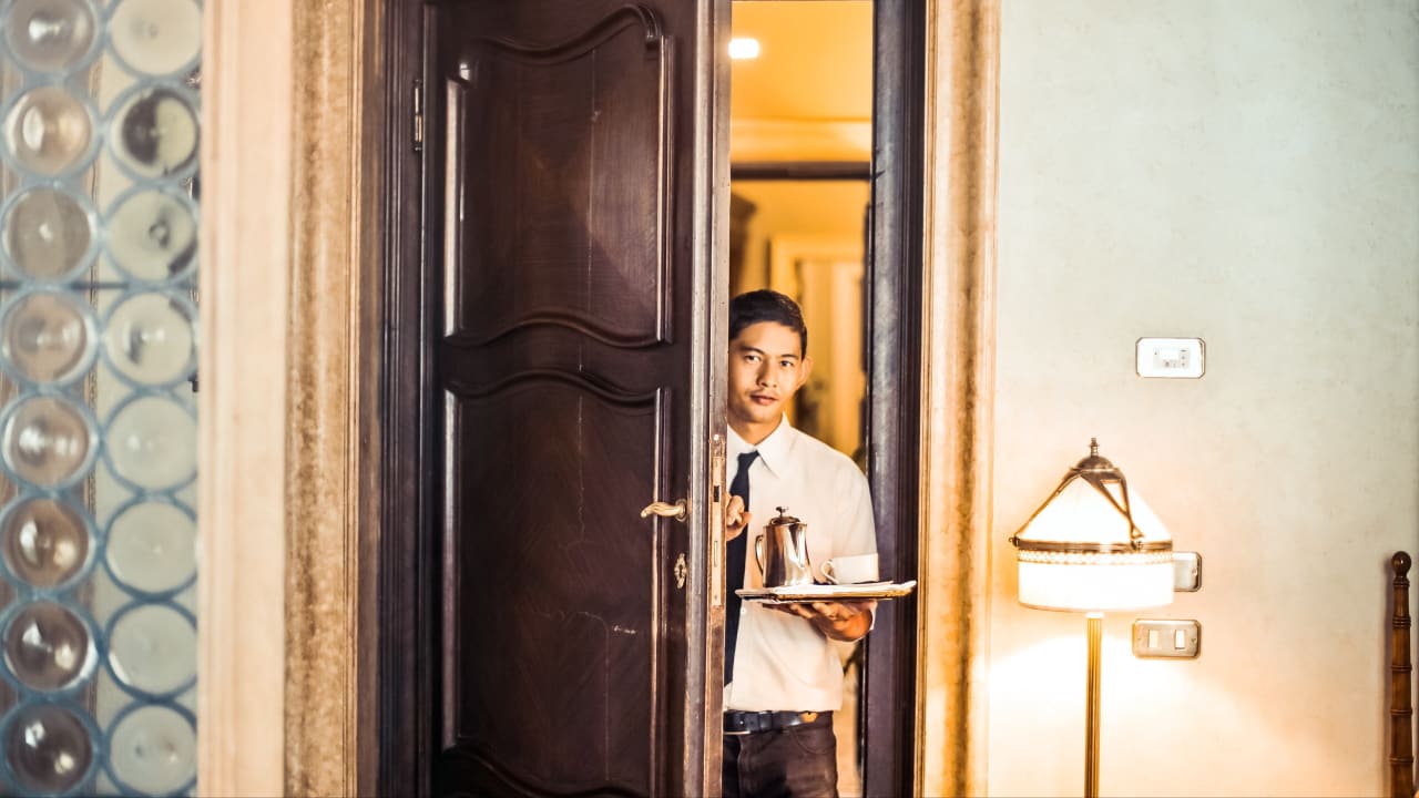 Gigpro FOH support staff helps with room service 