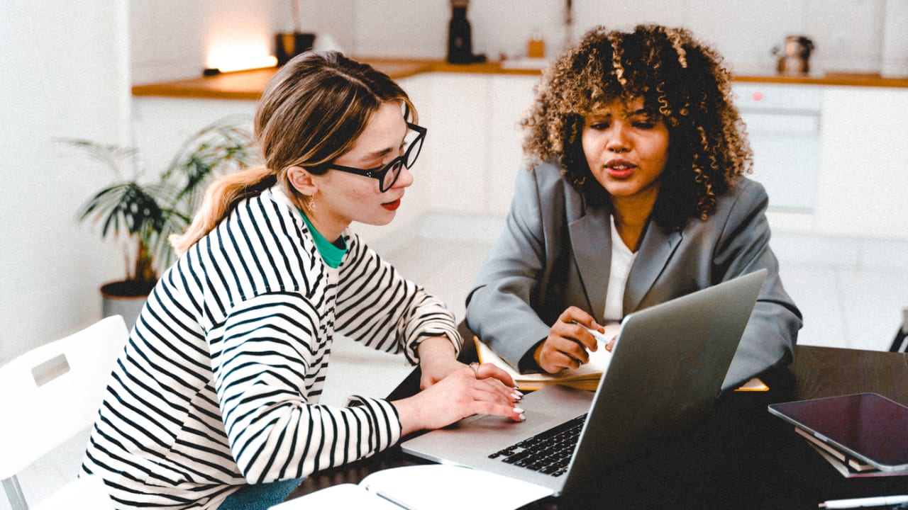 two women working together