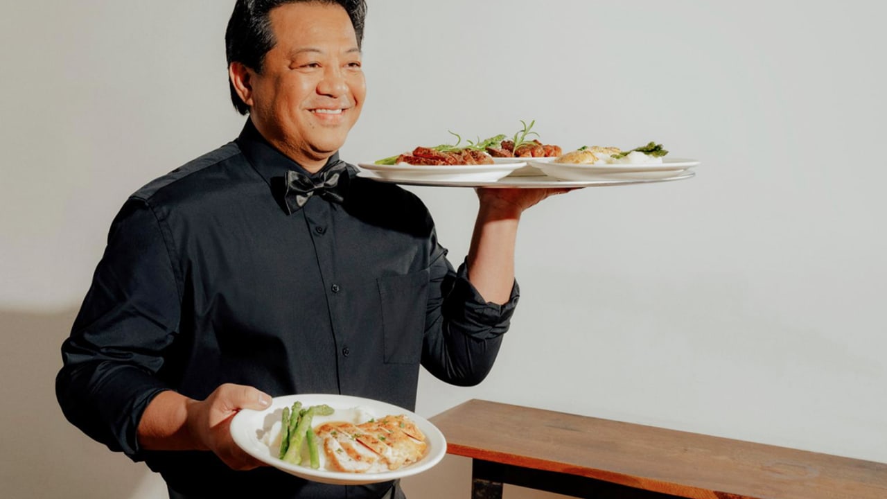 Catering staff carrying dishes