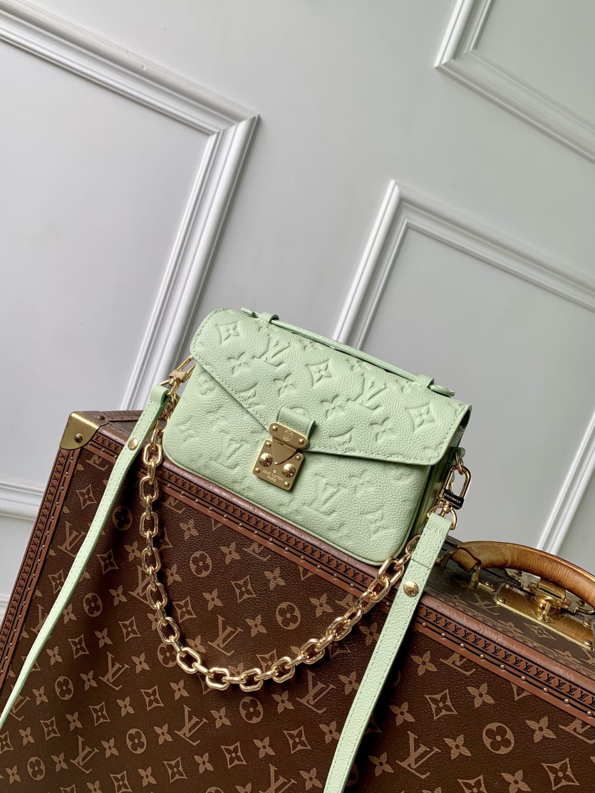 Pochette Métis East West Embossed Monogram Coated Shoulder Bag