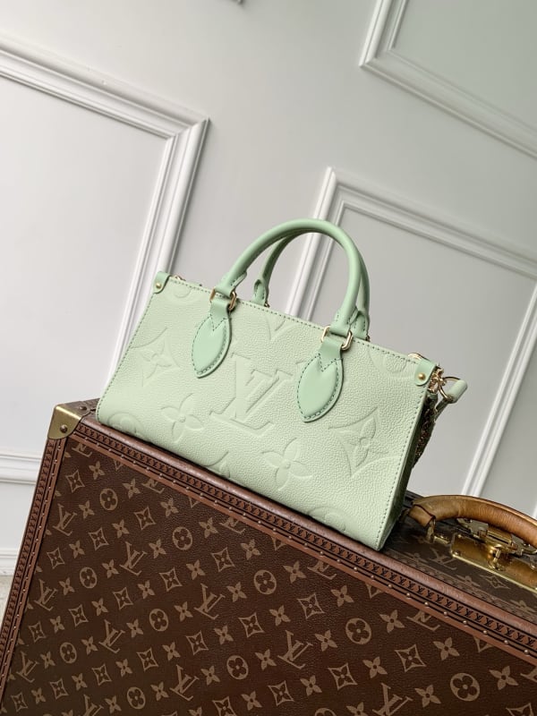Louis Vuitton Onthego East-West Embossed Monogram Coated Top Handle Bag