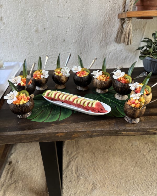 Fresh fruit served in coconut bowls at the retreat table