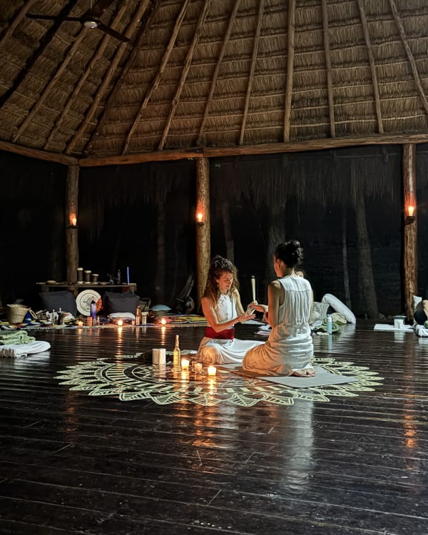 The ceremony space prepared with candles for the evening