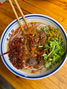 Rice noodles with beef and greens