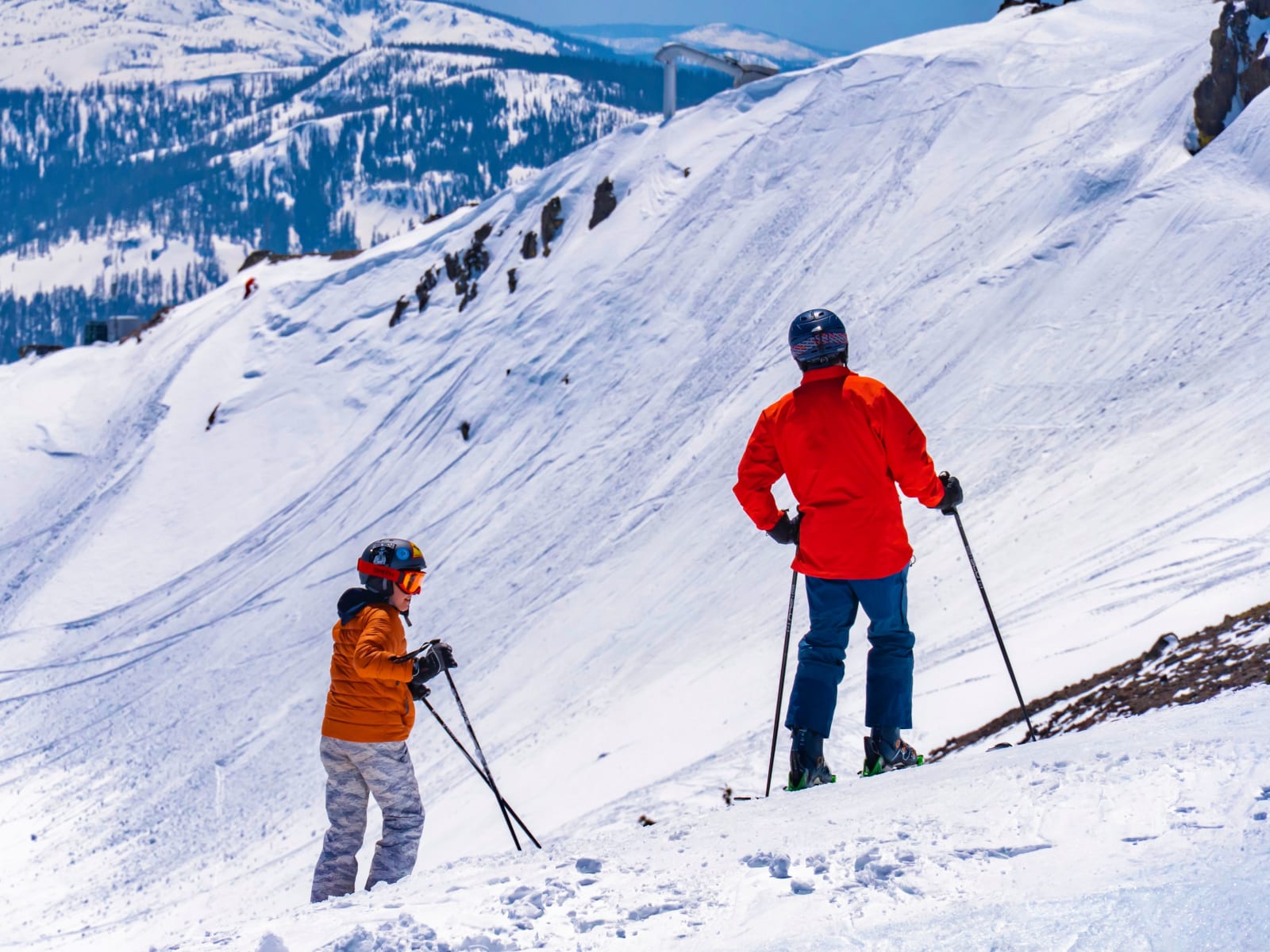 Two skiers on a snowy mountain slope in the United States