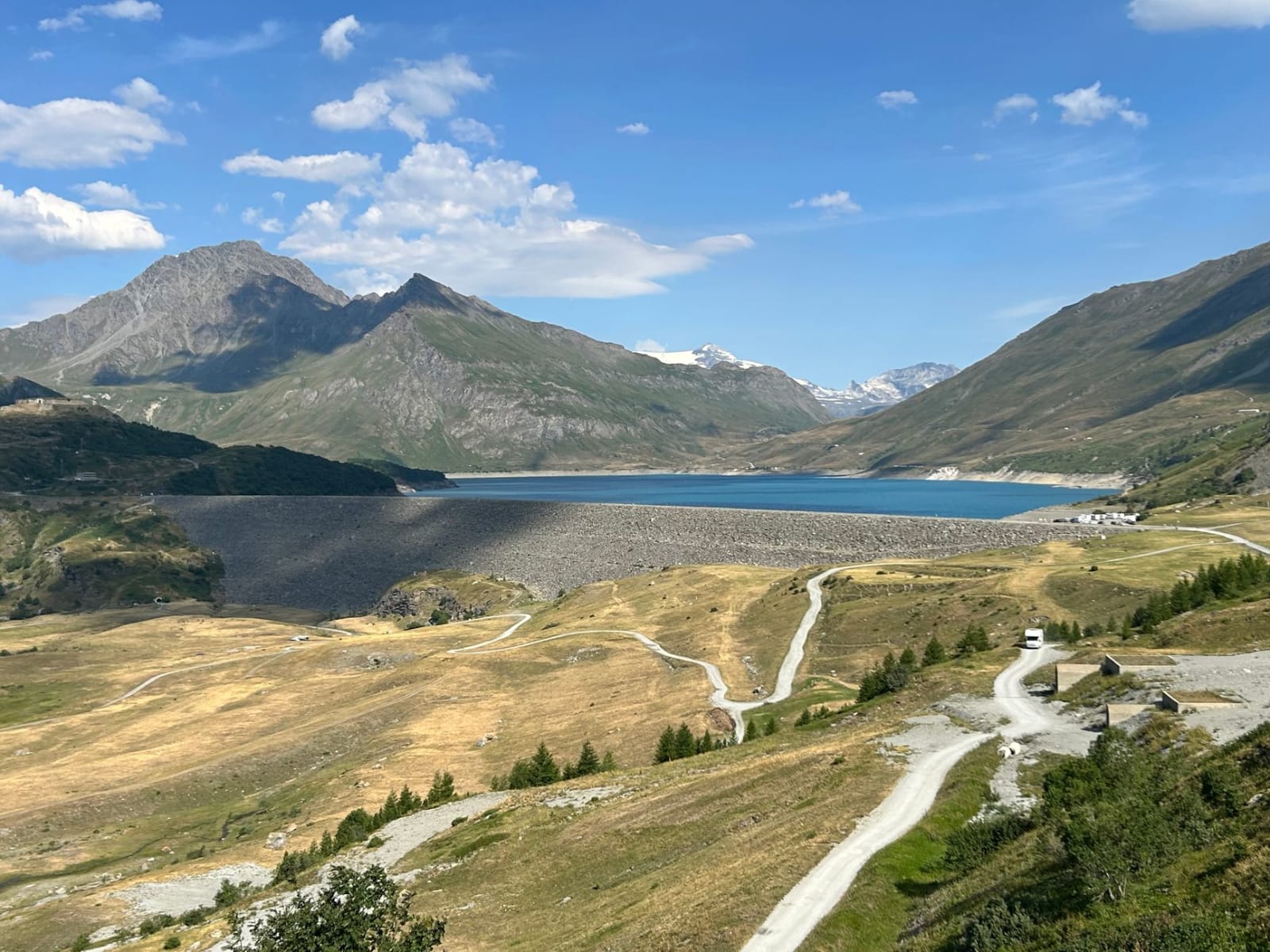 Breathtaking view of a tranquil mountain lake in Val-Cenis, French Alps on a sunny day.