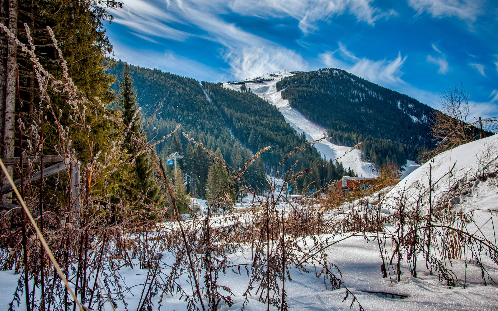 Snowy mountains and ski slopes above Bansko, Bulgaria