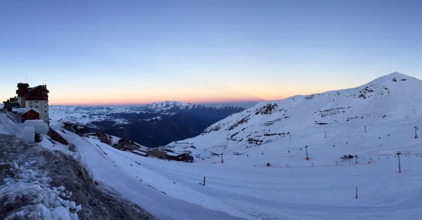 Snow-covered ski slopes at sunset above Lo Barnechea, Chile